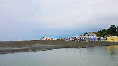 Beach with bungalow, houses on sand bar, Sochi,