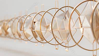 A row of suspended hoops adorned with varying sized geometric shapes