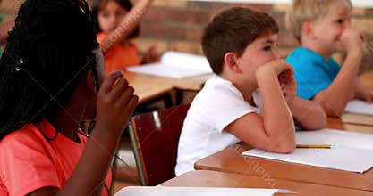 Pupils listening attentively during class