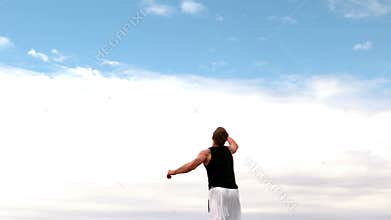 Martial arts expert practicing on the beach