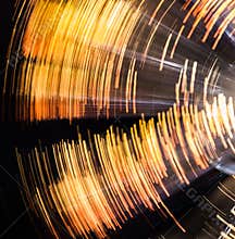Rotating Yellow and Black Circular Light Blur