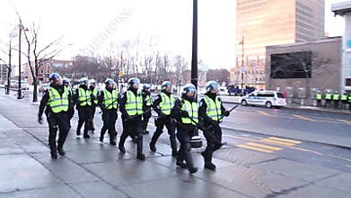 Riot police team marching and patrolling