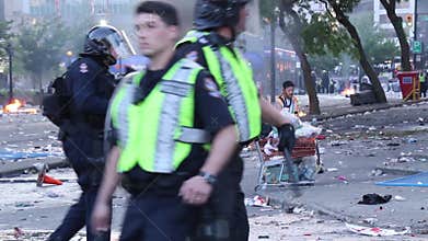 Homeless man let by riot officers to pick up bottles