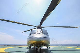 Helicopter parking landing on offshore platform. Helicopter transfer crews or passenger to work in offshore oil and gas industry