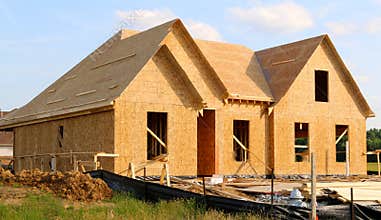 Wood Covered Frame of a Suburban Home Under Construction