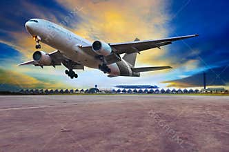 passenger jet plane landing on air port runways against beautiful dusky sky use for travel business and air transport