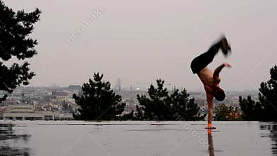 Breakdancer in the rain in Prague