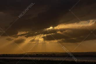 The rays of the sun break through the clouds in the late afternoon.