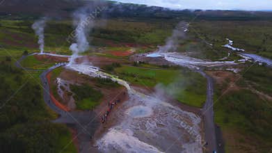 Aerial view of Geysir geothermal area with pools and steam