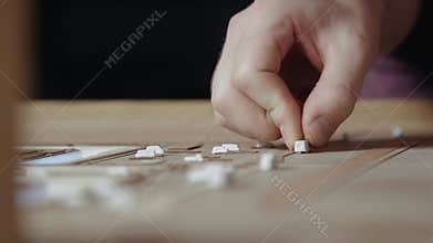 Hands of Professional Man Constructing Architecture Model of Urban Town Building