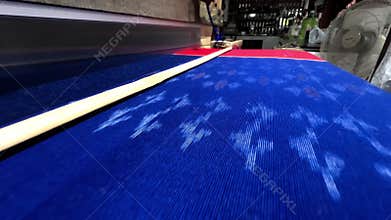 Traditional Thai Silk and Cotton Weaving with Colorful Thread Spools in Authentic Handloom Craft