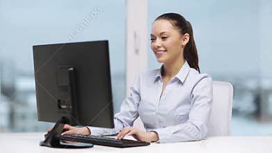 Businesswoman with computer in office