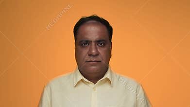 Portrait of Old Indian Man as Adult Model Opening Eyes and Looking at Camera