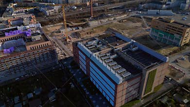 supercomputer in modern datacenter building in city. Nice aerial view drone
