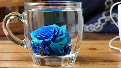 Blue floral tea blooming in a glass, Generative AI