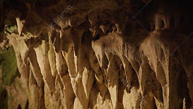 Meditation in a cave texture with stalactites and stalagmites in darkness.