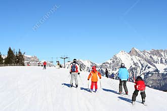 Families skiing in Alps