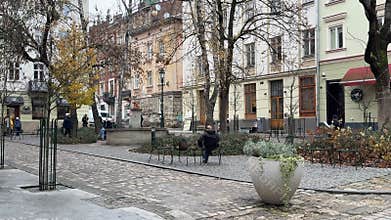 Ukraine, Lviv 01.04.2026 view of an old, arched entryway with a metal gate leading into a courtyard, flanked by an