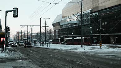 Cars and buses move through city traffic on dirty snow during winter conditions in central Belgrade. Belgrade, Serbia 9 January