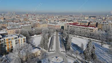 Aerial View Of Riga City Skyline On A Sunny Cold Winter Day With Snow Covered Rooftops