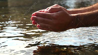 Collecting Water with Hands in the Sea.