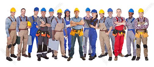 Confident manual workers against white background