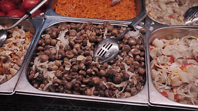 Fresh marinated mushrooms in a tray.