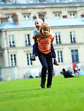 Happy kids, school girl and her little brother in city park