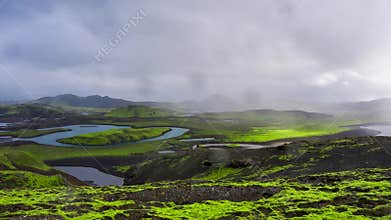 Aerial View of Icelandic Moss Covered Terrain with Rivers and Lakes