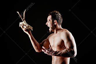 Brutal man with a deer skull