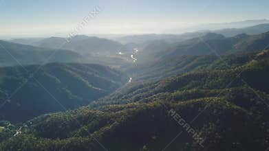 Aerial view of Chiang Mai Province in Thailand showing forested mountains and river