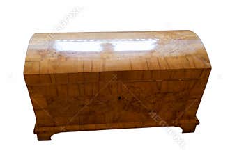 Wooden chest with a curved top, showcasing fine craftsmanship and natural wood patterns, suitable for storage or decoration
