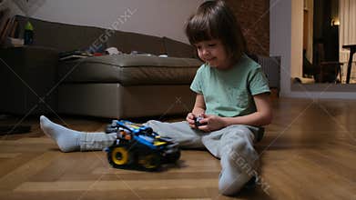 Child Immersed in Play with a RemoteControlled Car in the Comfort of Their Home