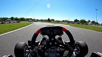 Go Kart Racing at High Speed at a Track on a Sunny Afternoon