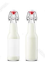 Fresh milk in clear glass 330ml bottle with swing top cap isolated on white