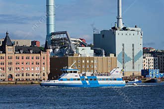 Vasttrafik ferry crossing Gota river in front of the Roselundverket combined heat and power powerplant on May 10, 2025 in
