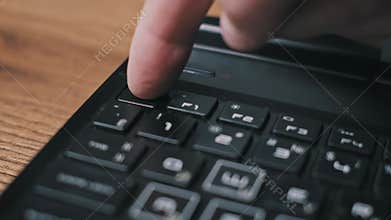 Finger Pressing ESC Key On Dusty Keyboard