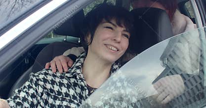 Cheerful female at Prague event shares affectionate fun moment