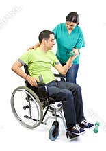 Physical therapist works with patient in lifting hands weights.