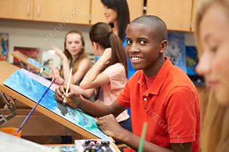 Male Pupil In High School Art Class