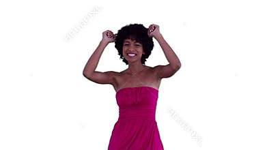 Woman dancing while raising her arms