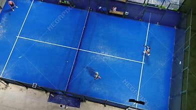 Intense Rally Captured From Drone View, Highenergy Padel Match With Focused Players And Spectators