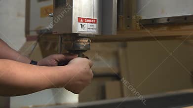 Technician Calibrates Equipment, Precision Technician Carefully Calibrates Machinery In Workshop Environment. Media