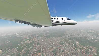 Private Jet Flying Above Clouds