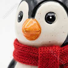 Penguin figurine with scarf