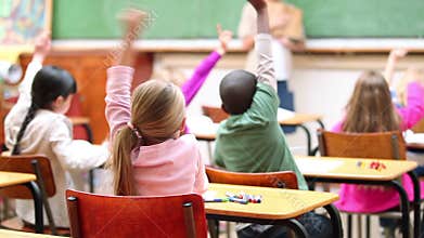classmates raising their arms