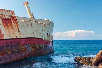 Rusty the Edro III shipwreck, Pegeia, Cyprus on a quiet sea shore under a clear blue sky