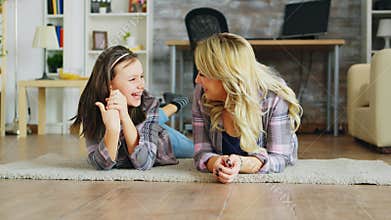 Little girl with braces lying on the floor