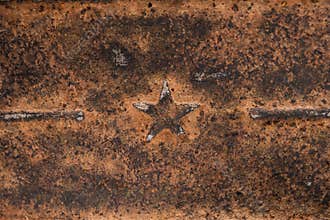 Five-pointed Soviet star on rusty metal. Rusty iron background