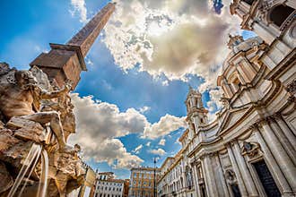Fountain of rivers in Rome in Italy. In the background, the baroque church of Santa Agnese in Agone